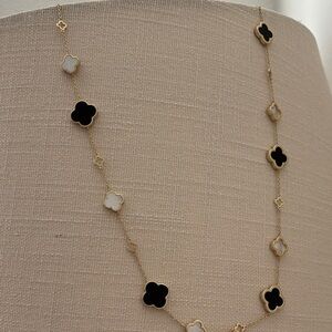 Elegant Gold and Black Clover Necklace